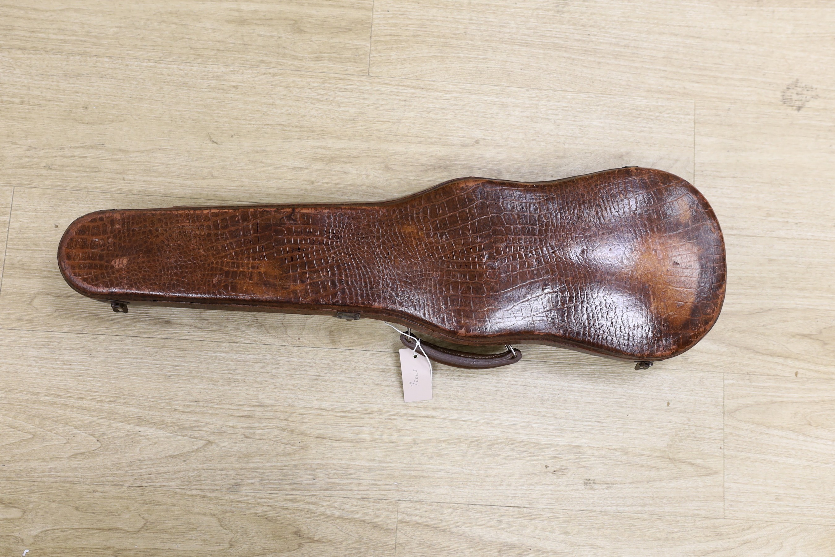 A crocodile skin violin case, formerly belonging to Jim Taylor of Lewes